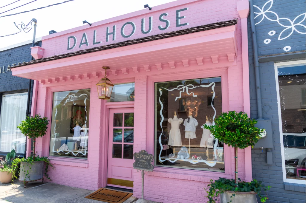 Exterior pink brick storefront for Dalhouse - a children's clothing store in Raleigh, NC.